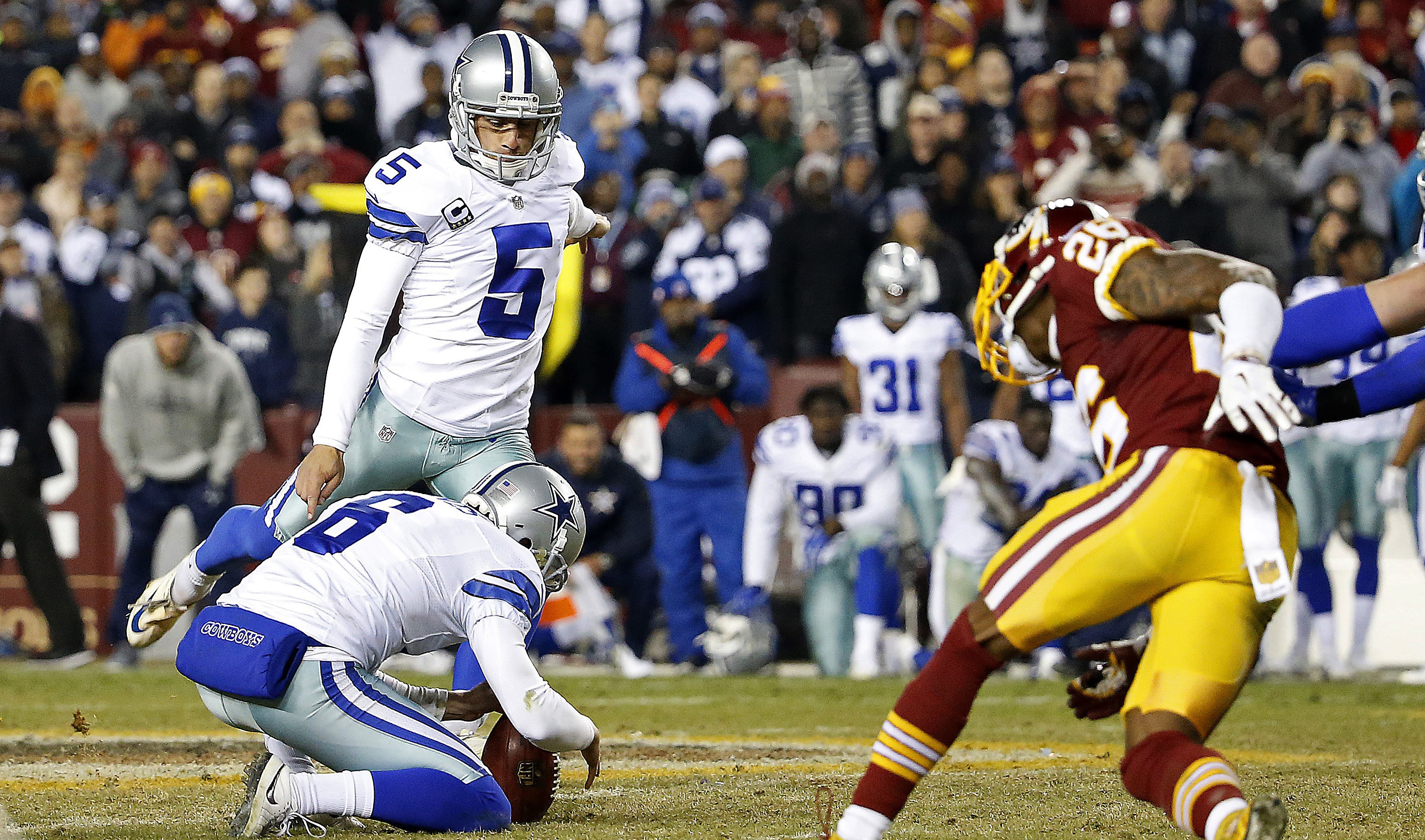 Dallas Cowboys quarterback Matt Cassel (16) walks off the field after  leading his team to a 19-16 victory over the Washington Redskins at FedEx  Field in Landover, Maryland on Monday, December 7