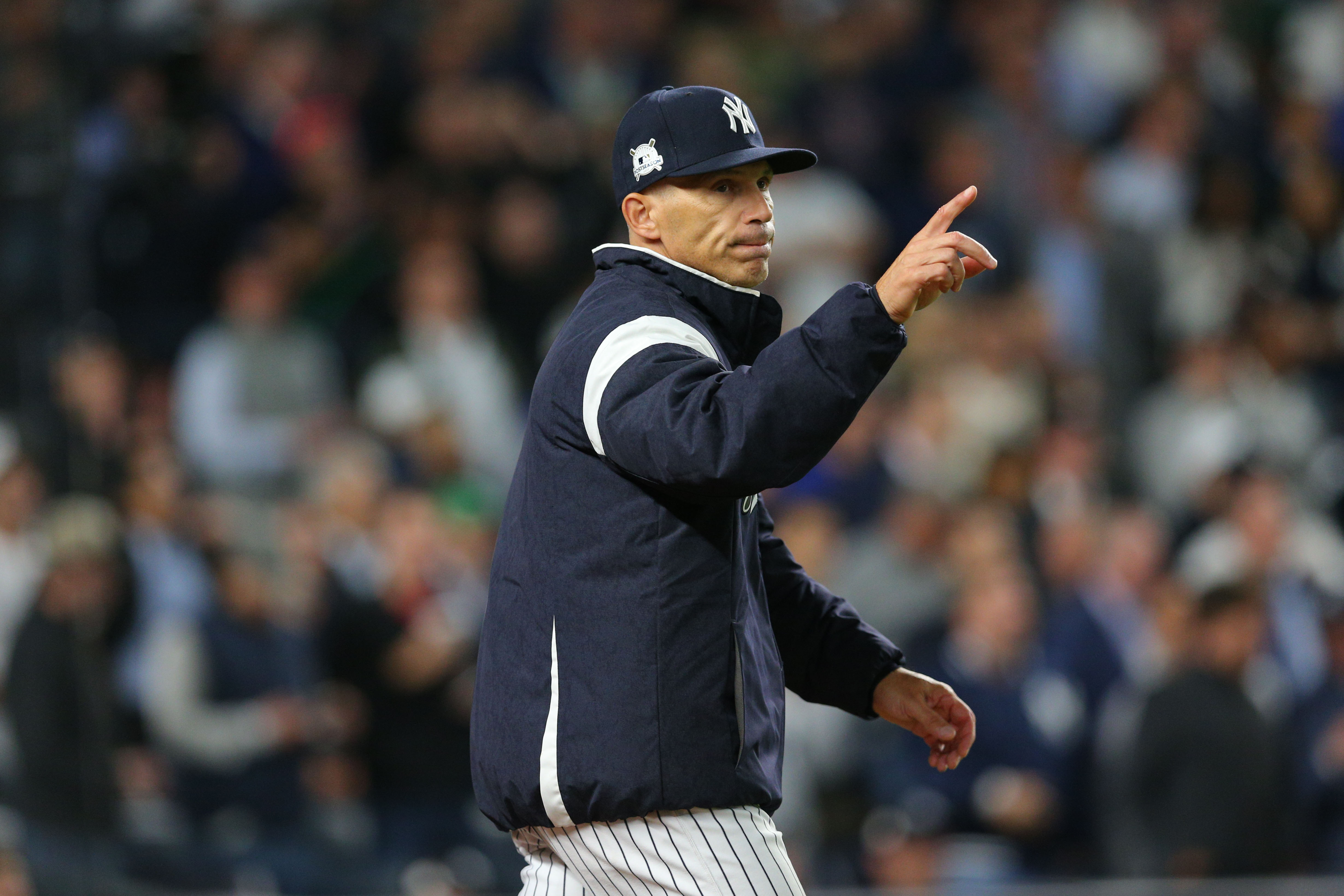 New York Yankees manager Joe Girardi, left, talks with pitcher