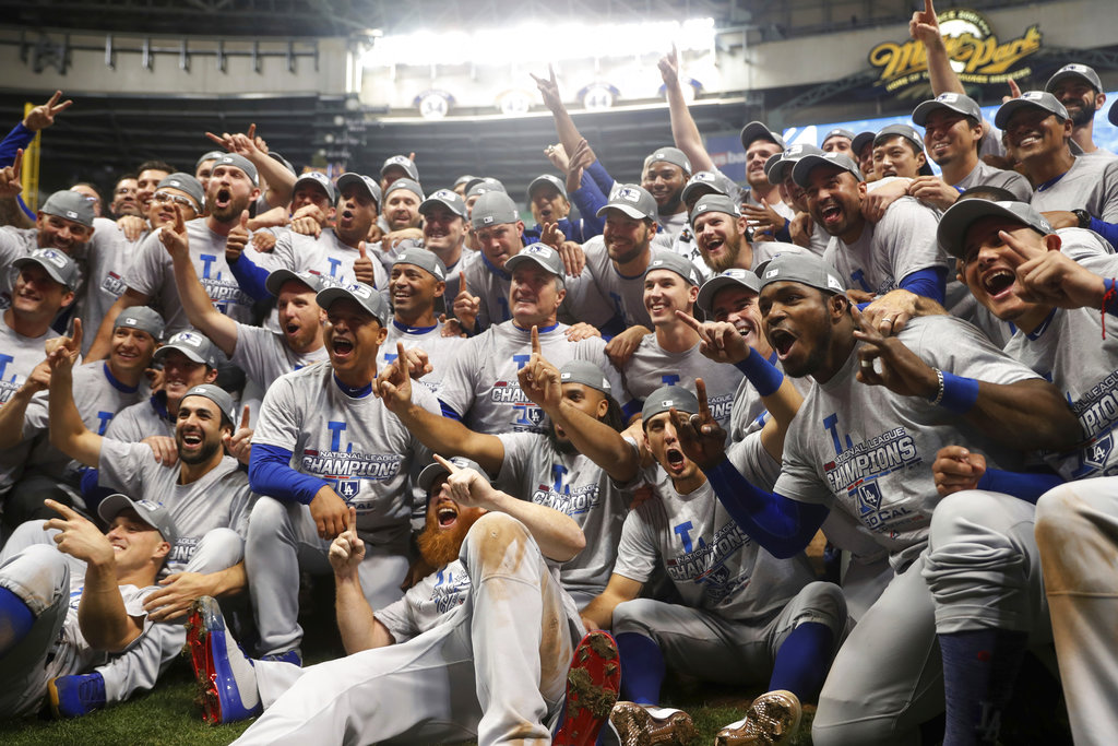 Los Angeles Dodgers Players Return To The Dugout After A Ceremony To