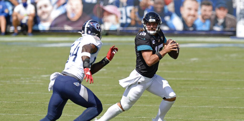 Henry runs for 215 yards, Titans beat Jaguars, 31-10