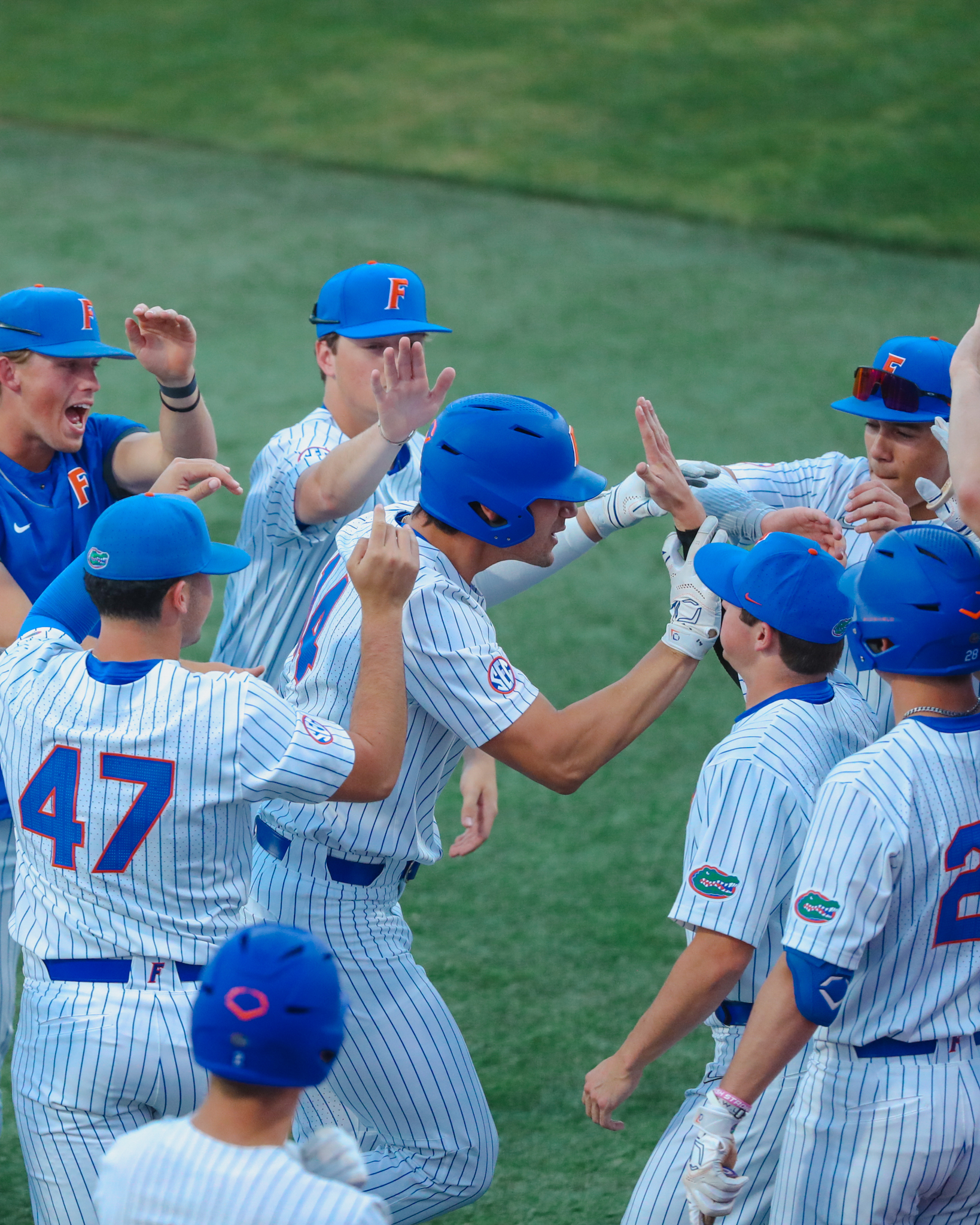 Florida infielder Josh Rivera (24) warms up before an NCAA