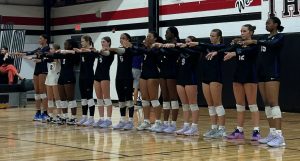 Gainesville Hurricanes volleyball team line up before game.