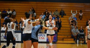 Santa Fe volleyball team celebrating after a point.