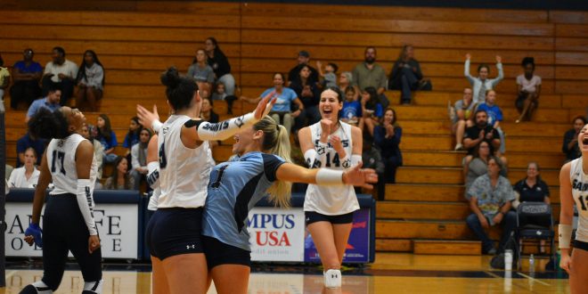 Santa Fe volleyball team celebrating after a point.