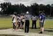 St. Francis Catholic and DeWitt Taylor meet at midfield for the pregame coinflip. [Charlie Jones]