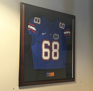 Jim Barrie's No. 68 Florida jersey hangs from the wall at BarrieHaus.