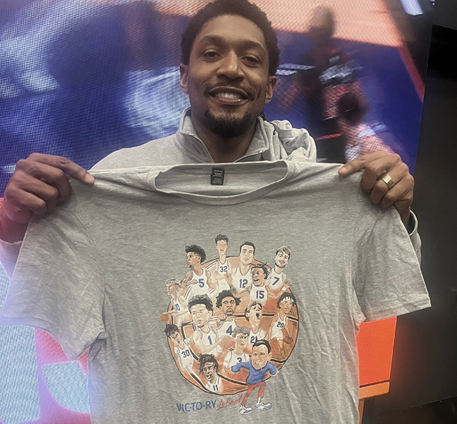 Bradley Beal holds up a T-shirt celebrating this year's Florida basketball team at PHX Arena on Wednesday.